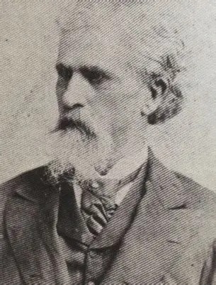 Portrait photograph of Colonel William Clark Falkner, a bearded man in a dark coat and cravat, in later life.